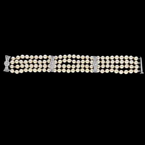 fig 8. A vintage four-strand cultured pearl bracelet connected by three white gold bow-shaped spacers set with small diamonds.