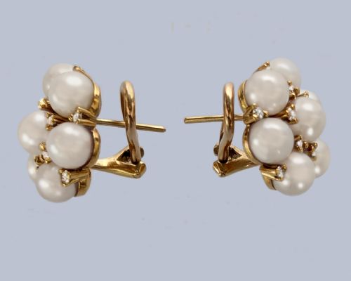 fig 2. A pair of 1960s 18ct gold flowerhead cluster earrings set with central and surrounding cream pearls interspersed with diamond accents.