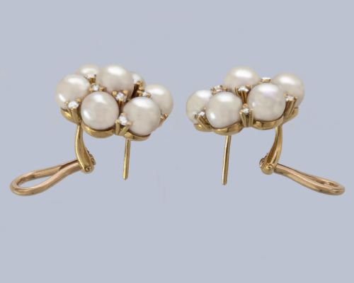 fig 3. A pair of 1960s 18ct gold flowerhead cluster earrings set with central and surrounding cream pearls interspersed with diamond accents.