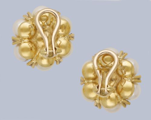fig 8. A pair of 1960s 18ct gold flowerhead cluster earrings set with central and surrounding cream pearls interspersed with diamond accents.