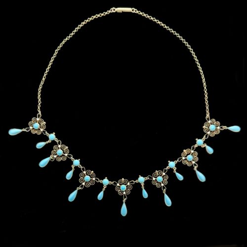 fig 8. An Art Nouveau silver gilt festoon necklace featuring filigree scrollwork, turquoise guilloche enamel discs, and suspended teardrop pendants.