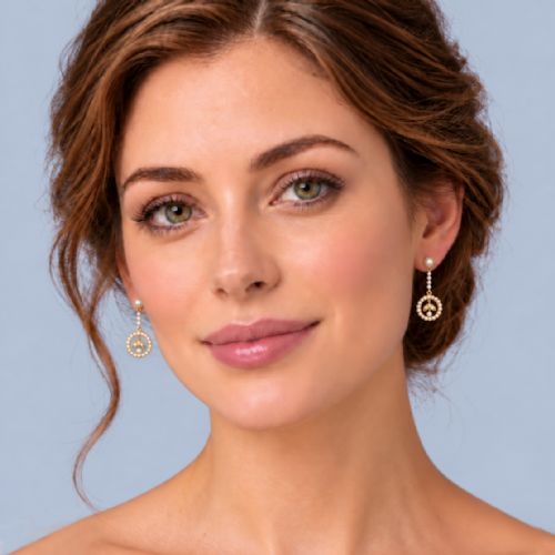 fig 1. A pair of Edwardian 15ct yellow gold drop earrings featuring circular seed pearl frames around foliate central motifs with screw-back fittings.