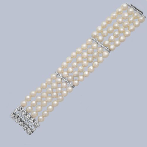 fig 6. An Edwardian four-strand pearl bracelet featuring a central openwork diamond floral clasp in white metal.