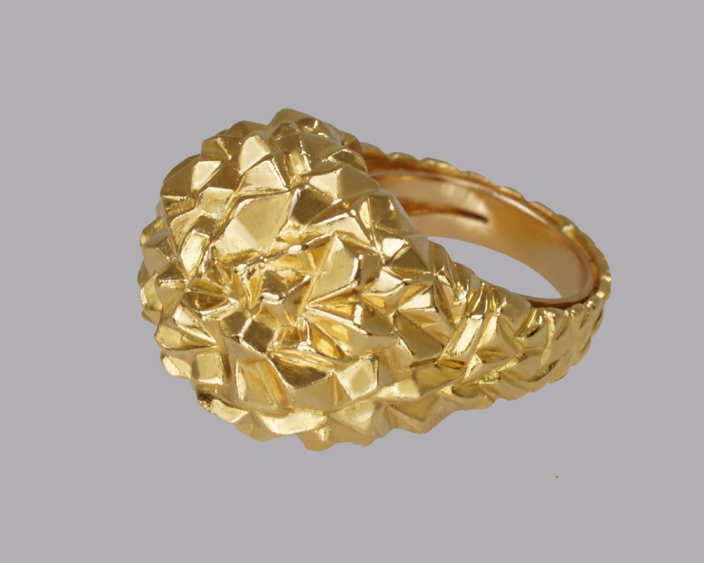 A heavy 18ct yellow gold bombe ring featuring a faceted geometric textured surface with an adjustable inner band. View VIII