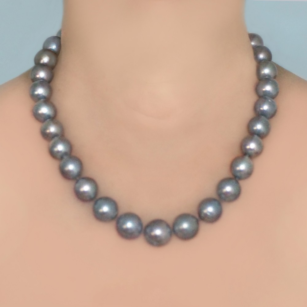 A single strand of lustrous charcoal grey Tahitian cultured pearls featuring an 18ct white gold clasp.