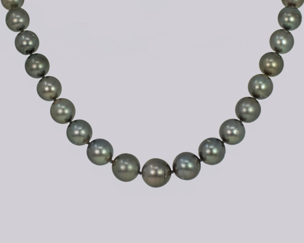 A single strand of lustrous charcoal grey Tahitian cultured pearls featuring an 18ct white gold clasp. View V