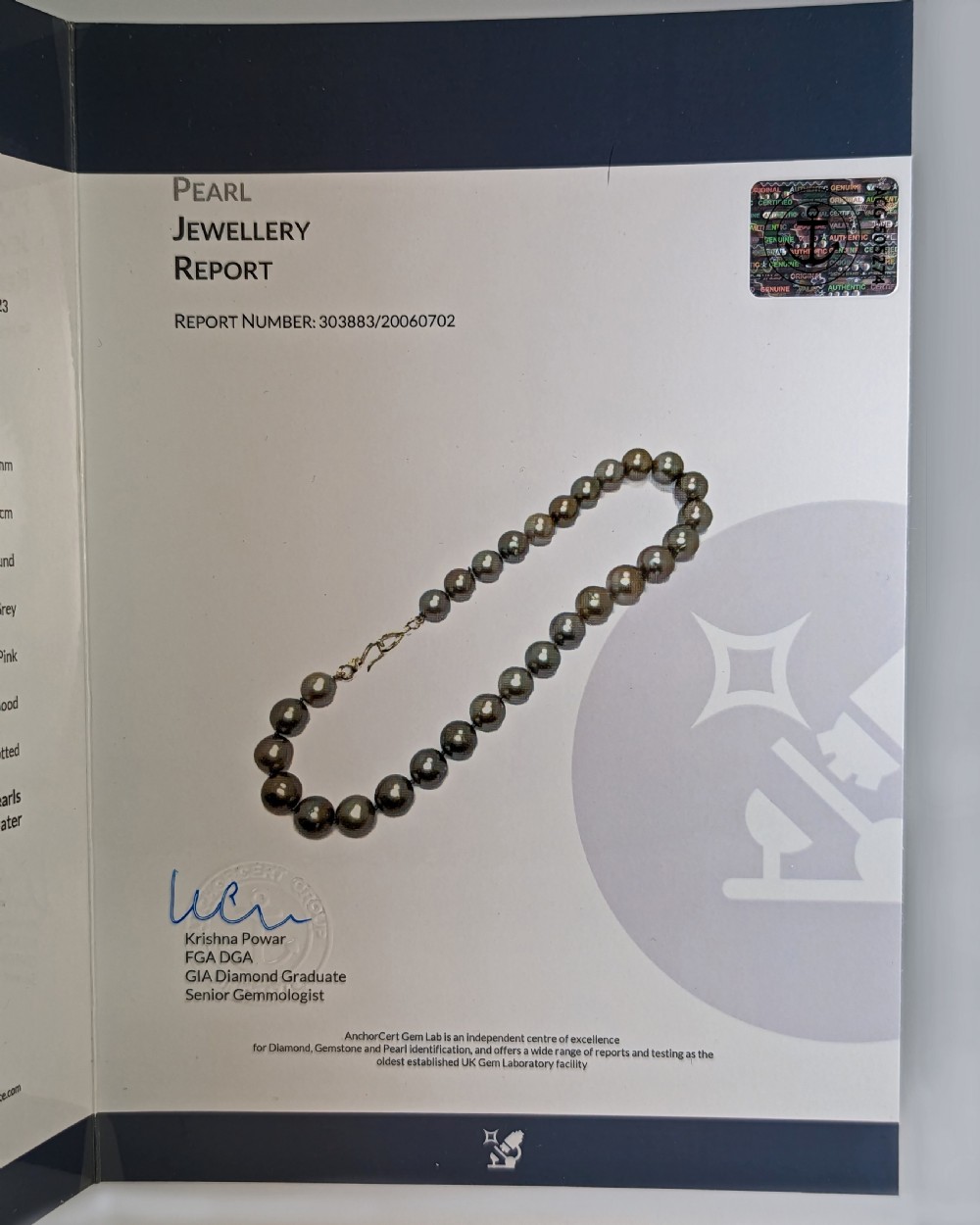 A single strand of lustrous charcoal grey Tahitian cultured pearls featuring an 18ct white gold clasp. View XI