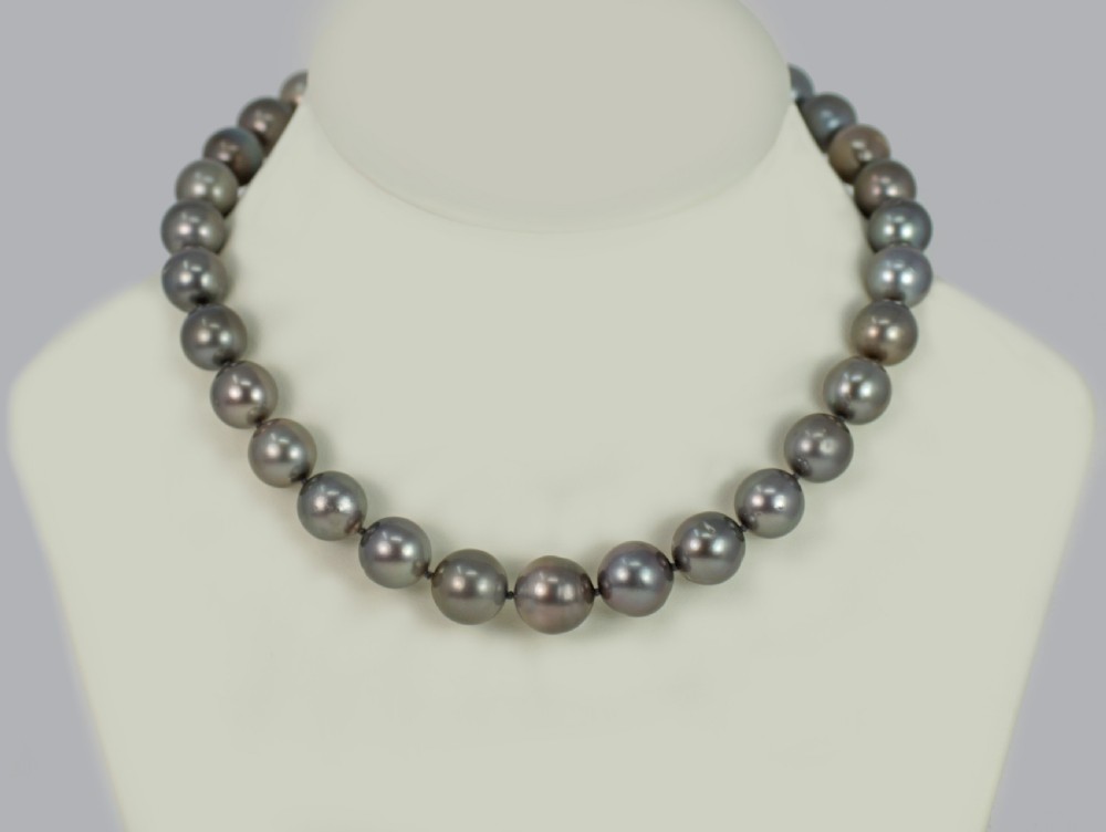 A single strand of lustrous charcoal grey Tahitian cultured pearls featuring an 18ct white gold clasp. View XII