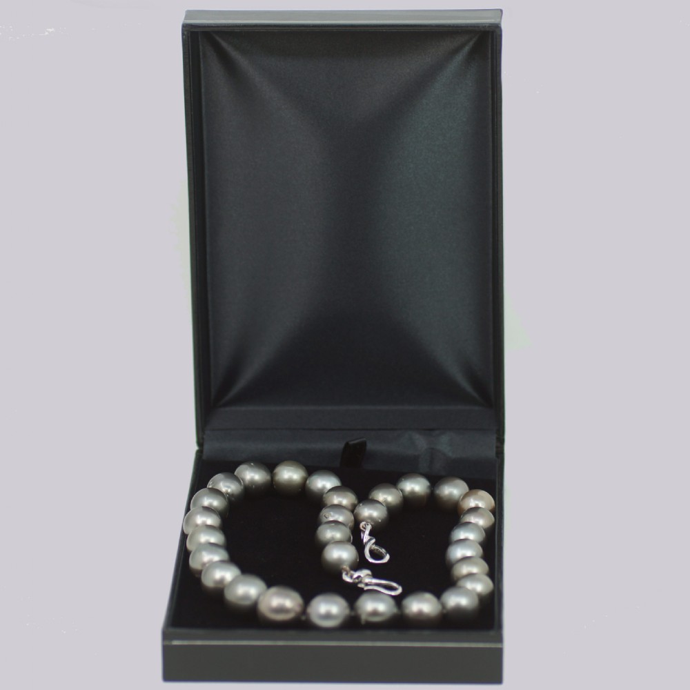 A single strand of lustrous charcoal grey Tahitian cultured pearls featuring an 18ct white gold clasp. View XIV