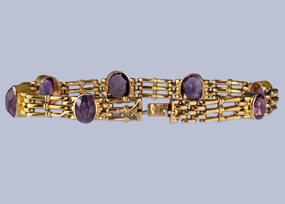 Victorian 9ct gold gate link bracelet set with six oval faceted purple amethyst gemstones and fitted with a safety chain. View III