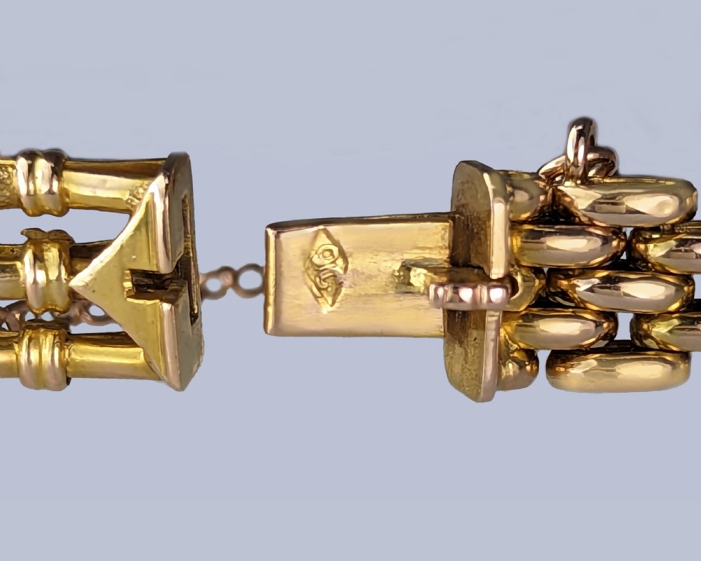 Victorian 9ct gold gate link bracelet set with six oval faceted purple amethyst gemstones and fitted with a safety chain. View IV