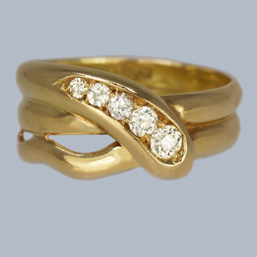 Victorian 18ct yellow gold coiled serpent ring set with five graduated old cut diamonds along the snake head.