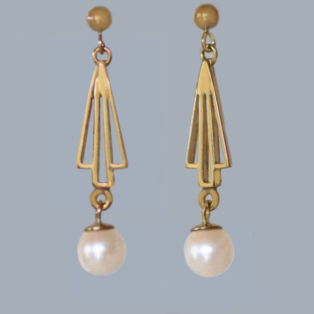 A pair of 9ct yellow gold drop earrings with geometric openwork triangular motifs suspending round cream pearls.