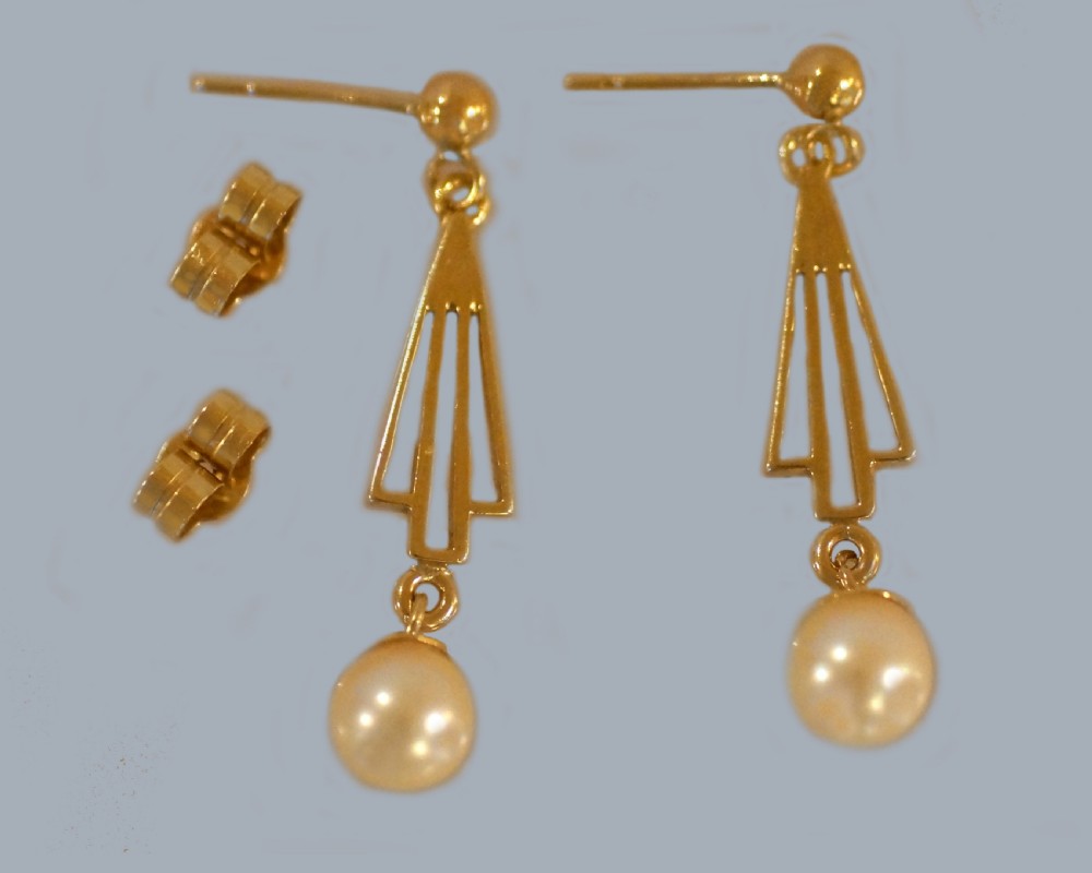 A pair of 9ct yellow gold drop earrings with geometric openwork triangular motifs suspending round cream pearls. View V