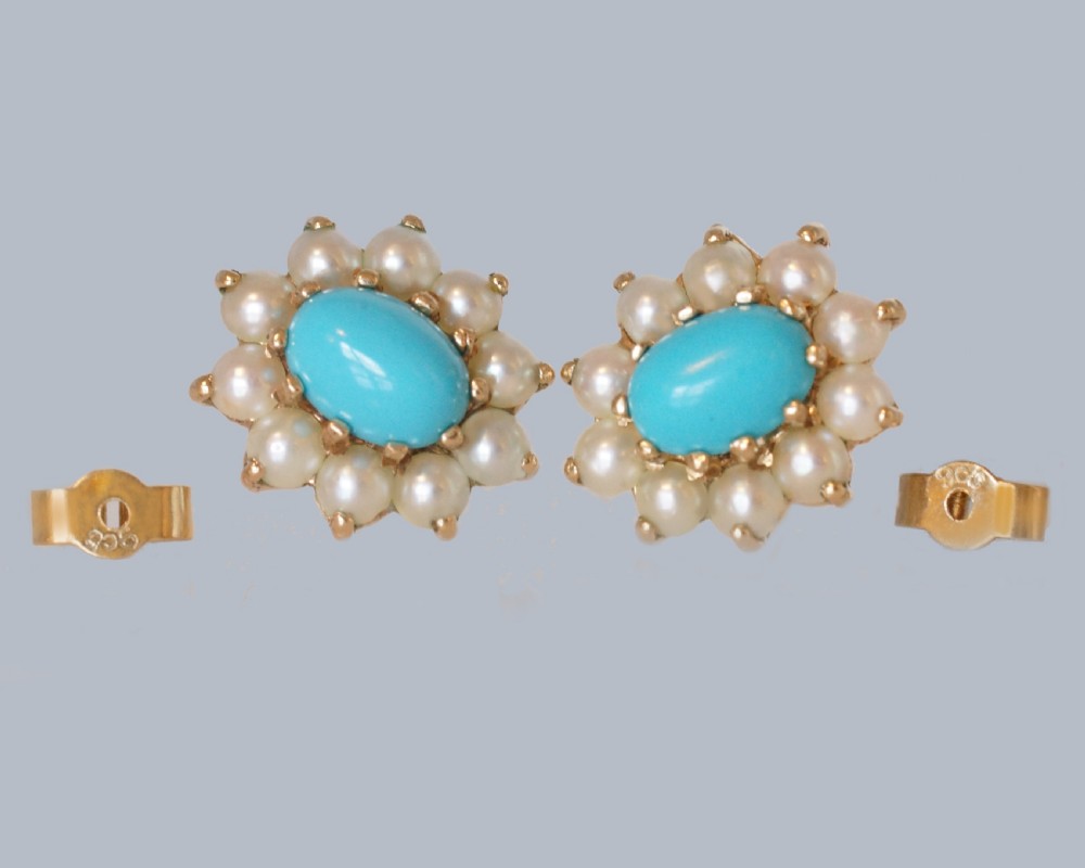 A pair of mid-century 9ct gold cluster earrings featuring central oval blue turquoise cabochons surrounded by halos of split pearls. View III