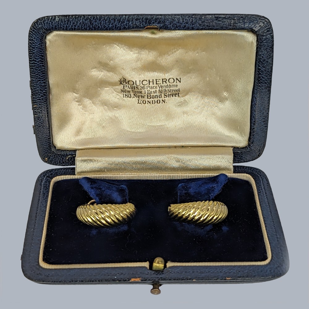 A pair of vintage 18ct yellow gold clip-on hoop earrings featuring a diagonal ribbed texture. View XVI