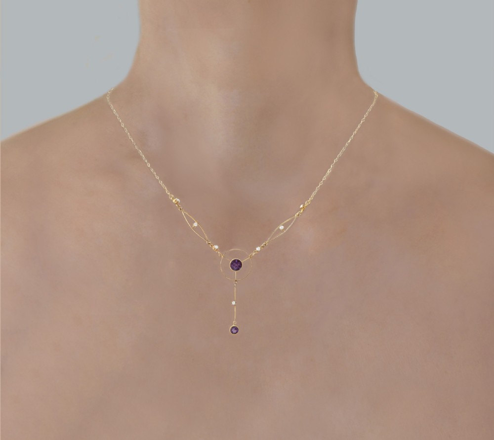 An Edwardian 18ct gold lavalier necklace featuring openwork geometric wire loops set with small diamonds, a central round bezel-set amethyst, and a vertical drop terminating in a second amethyst stone. View VIII