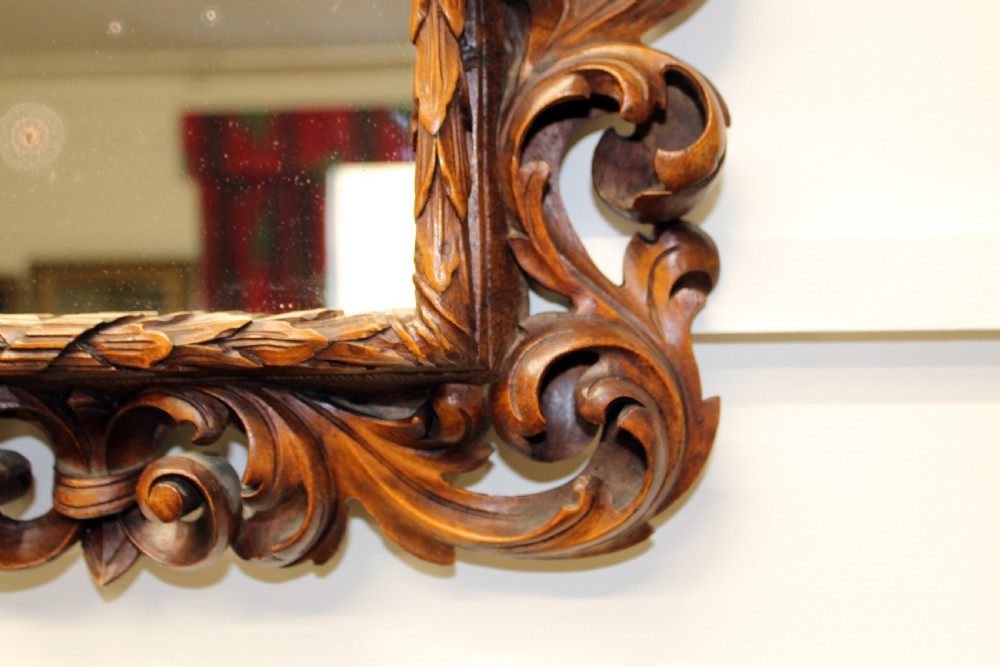 A pair of finely carved walnut  mirrors.  View VII