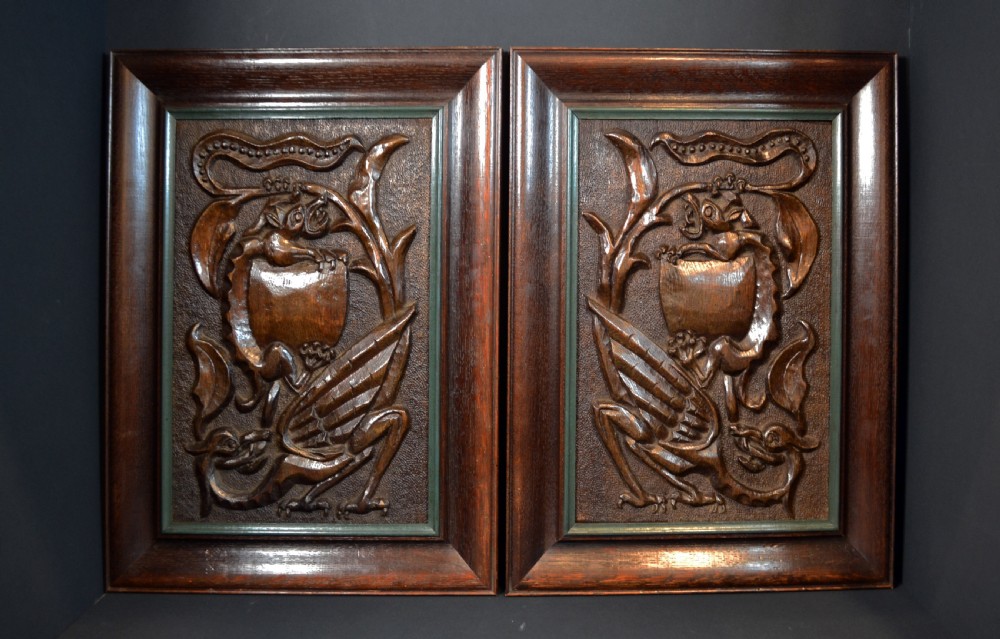 Superb pair of Arts and Crafts carved oak plaques