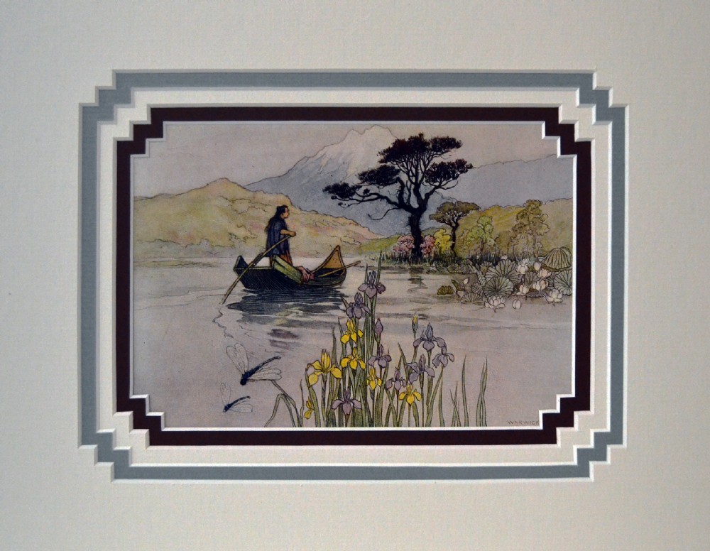 A framed antique book illustration by Warwick Goble depicting a figure in a small boat on a lake surrounded by irises and dragonflies with Mount Fuji in the background.