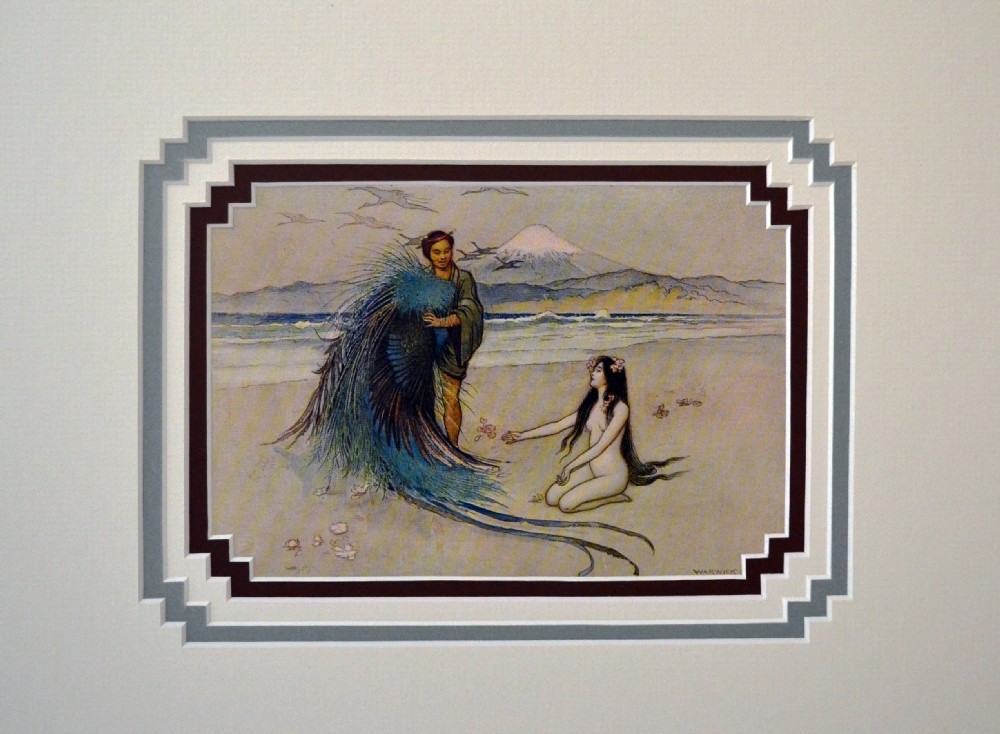 A mounted colour book print depicting two figures on a beach with Mount Fuji visible in the background, set within a multi-tiered stepped frame mount.