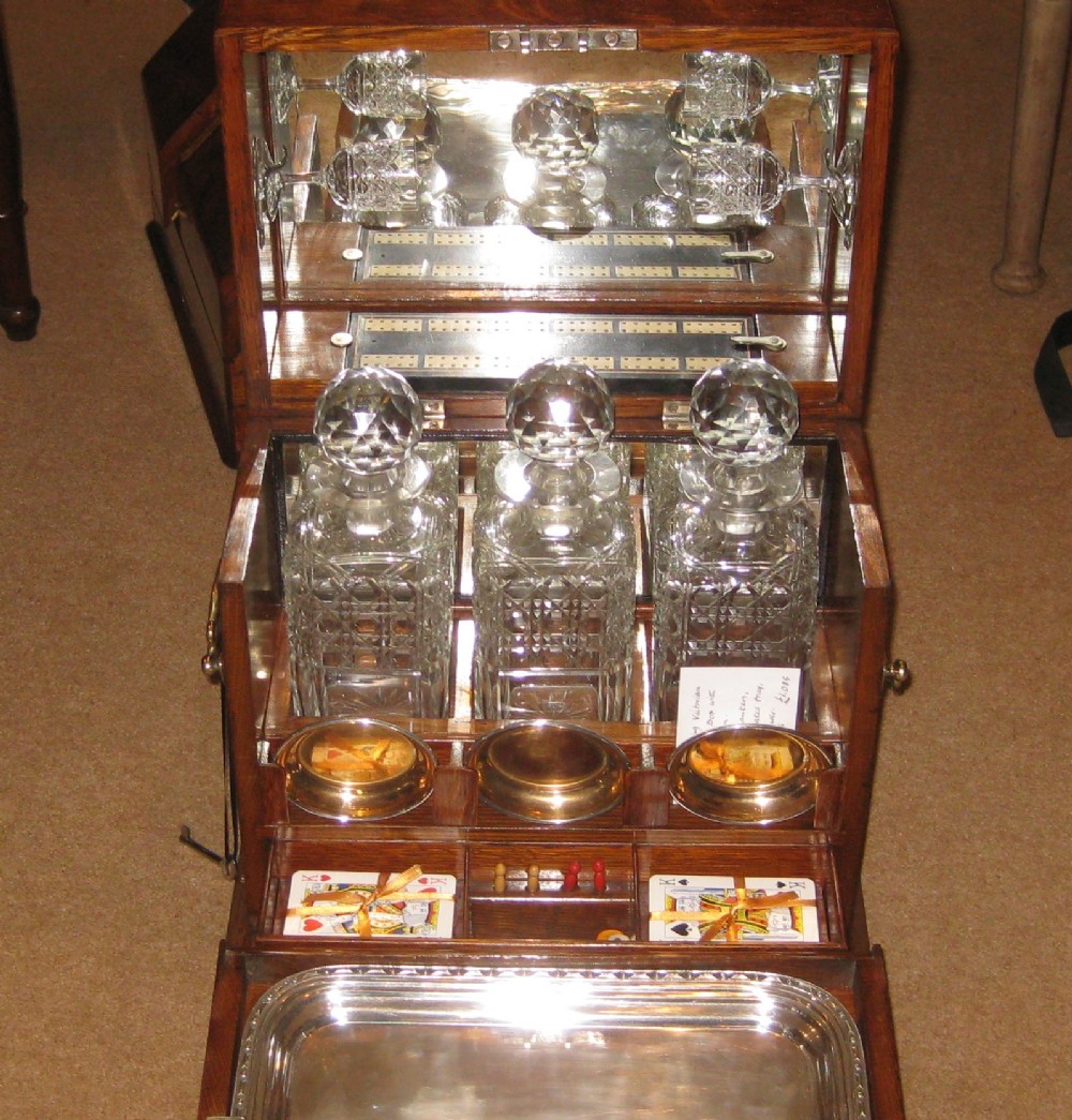 An outstanding Victorian oak, with brass decoration, Decanter box