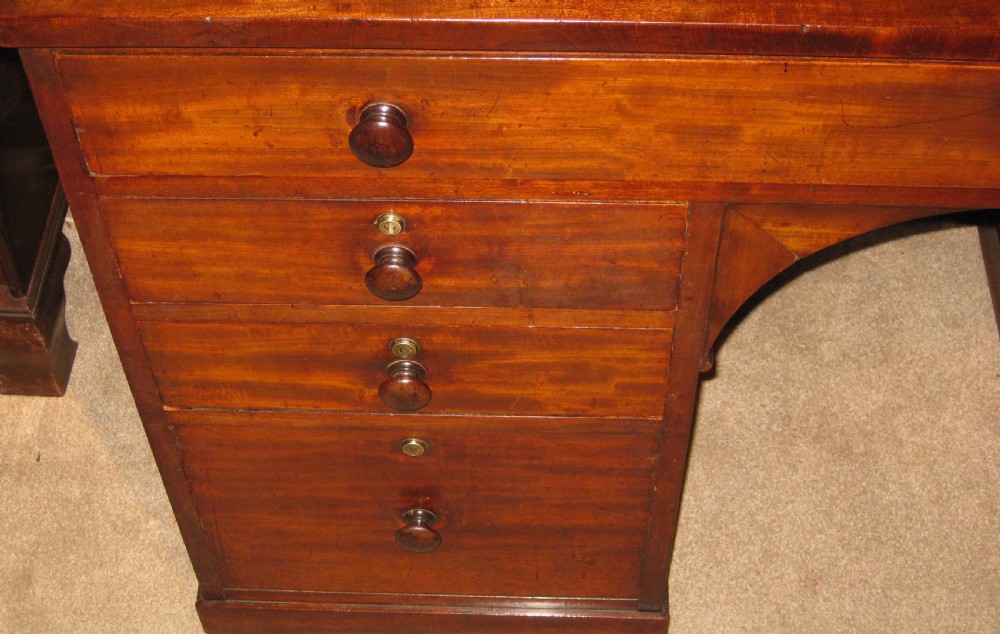 A fine quality early Victorian mahogany knee-hole desk. View VI