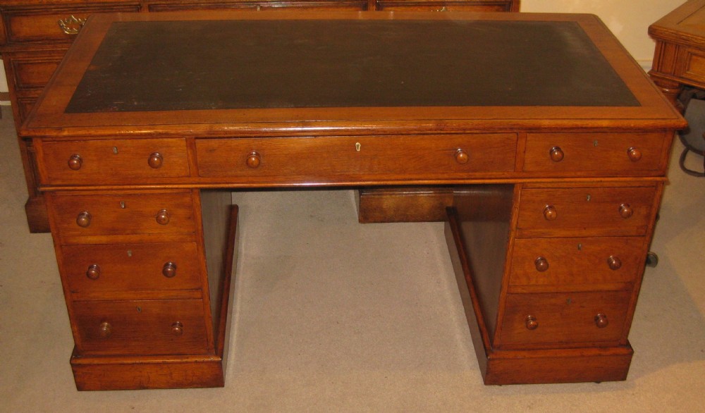 Victorian oak pedestal desk of classic proportions. View IV