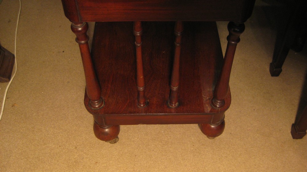 A Victorian mahogany three-tiered whatnot featuring turned support columns, a single drawer with turned wooden knobs, and a low top gallery with corner finials. View VIII