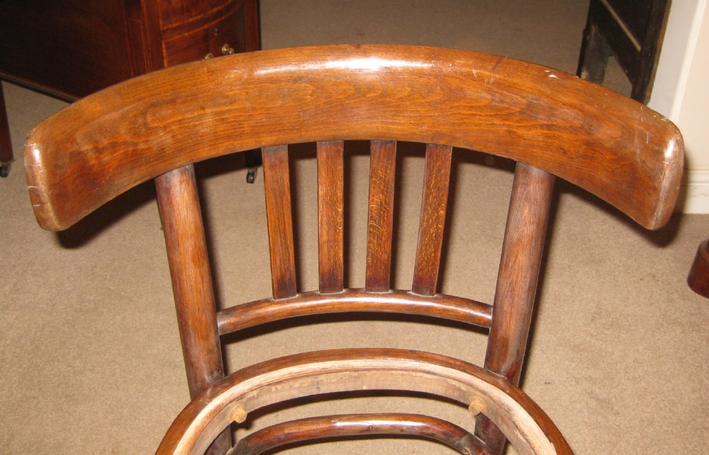 A dark brown steam-bent beechwood side chair featuring a curved backrest and a recessed frame for a drop-in seat pad. View VI