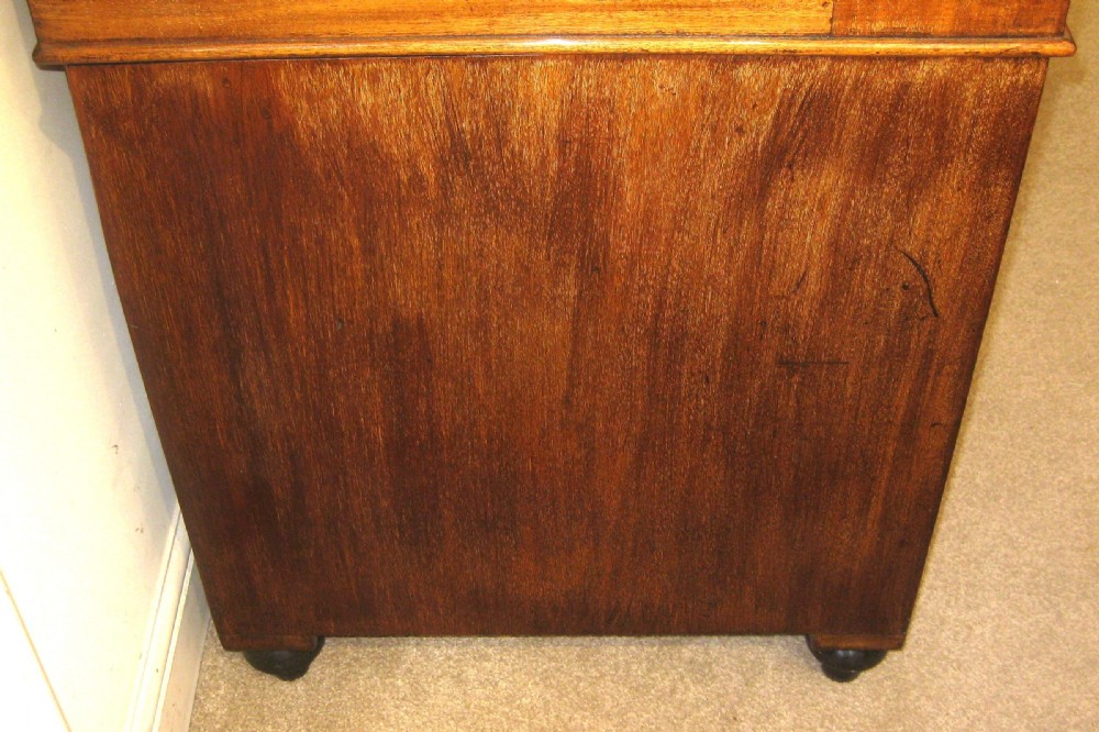 A Victorian mahogany campaign pedestal desk with a green leather top insert, recessed brass drawer pulls, and turned feet. View XI