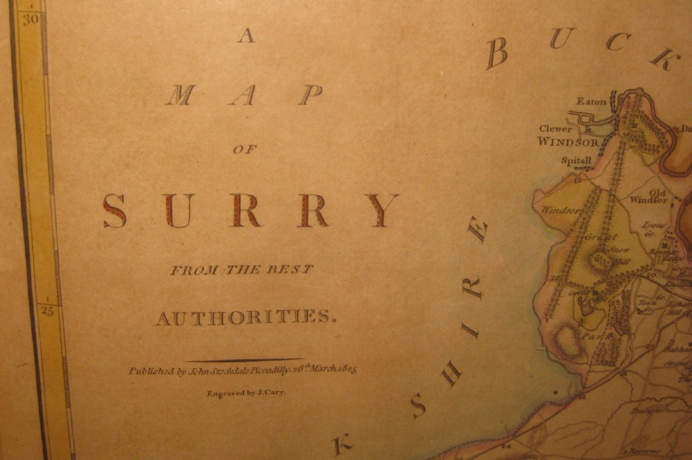 An antique hand-coloured engraved map of Surrey by John Cary set within a dark green mount and a thin gilt wooden frame. View II