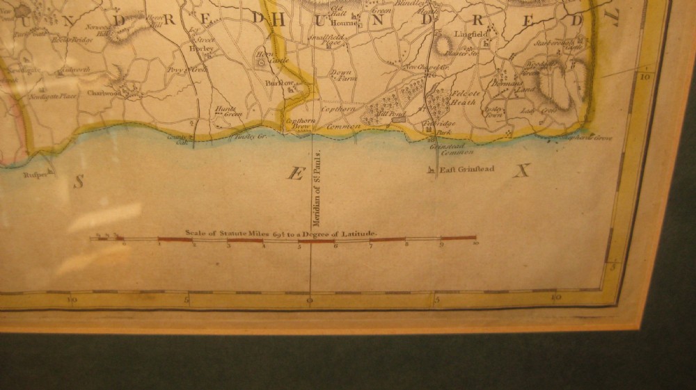 An antique hand-coloured engraved map of Surrey by John Cary set within a dark green mount and a thin gilt wooden frame. View III