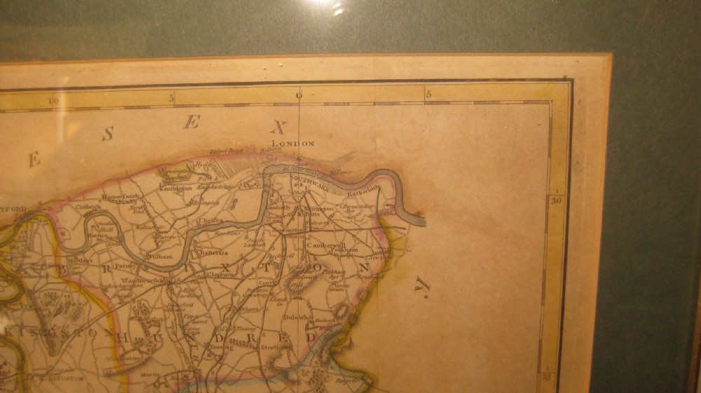 An antique hand-coloured engraved map of Surrey by John Cary set within a dark green mount and a thin gilt wooden frame. View IV