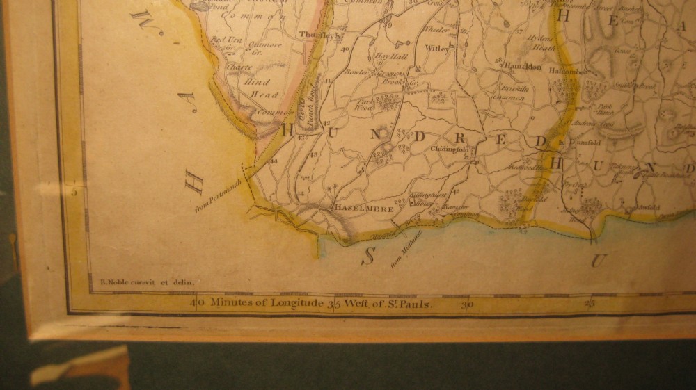An antique hand-coloured engraved map of Surrey by John Cary set within a dark green mount and a thin gilt wooden frame. View V