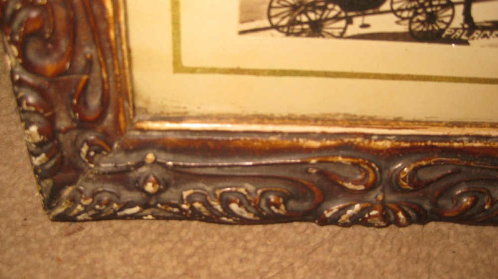 A pair of matching dark carved wooden frames containing sepia-toned historical photographs of the pier and seafront at Brighton. View IV
