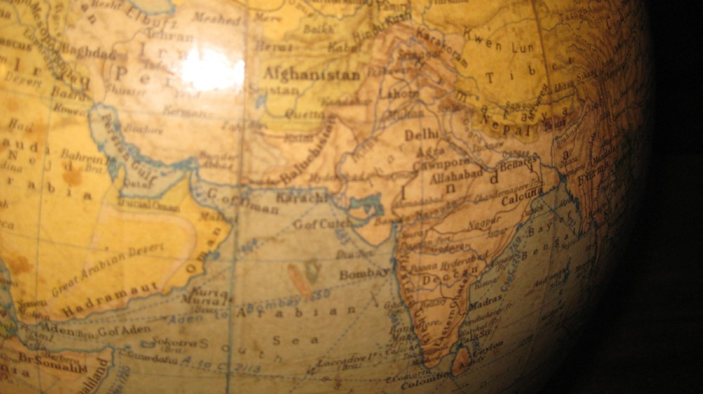 A 12-inch Philips terrestrial globe featuring printed geographical maps mounted on a square dark base. View V