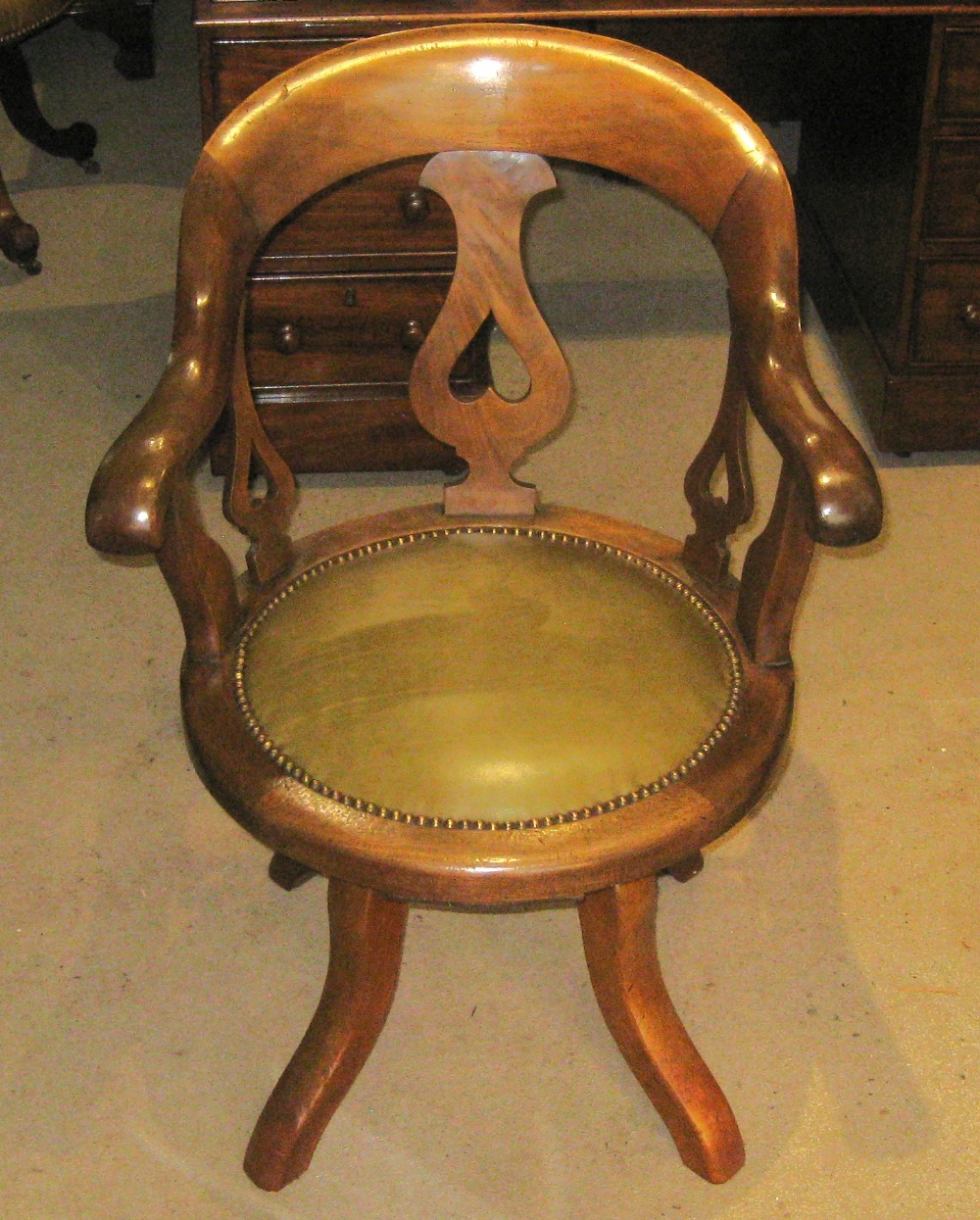 Victorian golden mahogany revolving desk chair.
