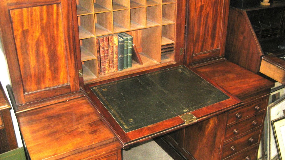 A Victorian mahogany estate managers desk featuring twin pedestal drawers and a fitted upper cabinet with panelled cupboard doors. View IV