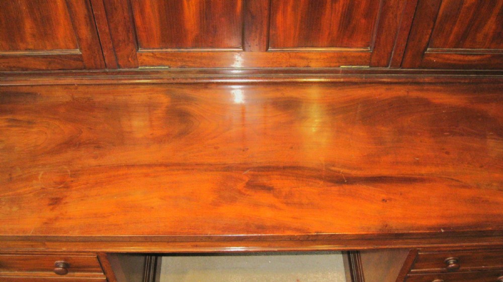 A Victorian mahogany estate managers desk featuring twin pedestal drawers and a fitted upper cabinet with panelled cupboard doors. View XIII