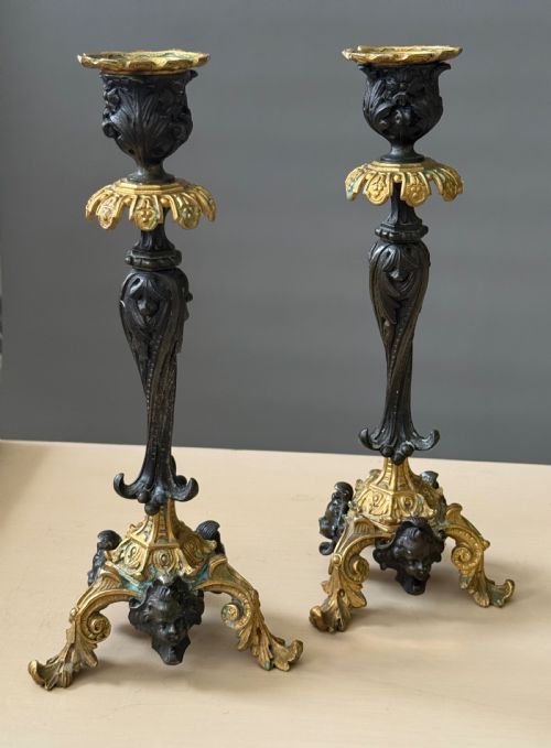 A PAIR OF LATE 19TH CENTURY PATINATED GILT BRONZE ROCOCO STYLE CANDLESTICKS