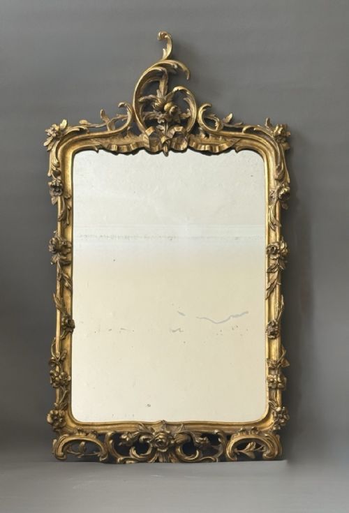 FRENCH ROCOCO CARVED AND GILDED MIRROR WITH ANTIQUE PLATE