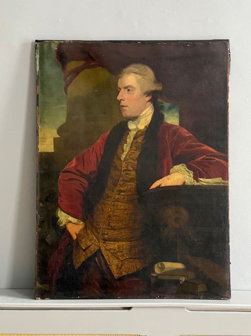 An 18th-century oil portrait painting depicting a seated gentleman in a red coat and embroidered waistcoat alongside a table with documents.