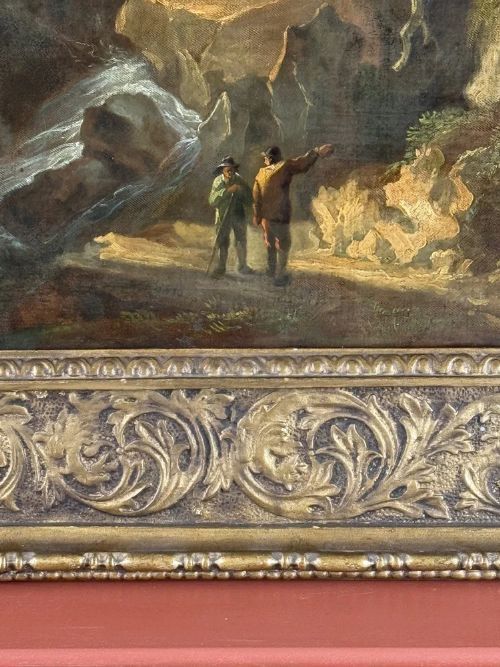 fig 1. A Georgian oil landscape painting on canvas depicting a mountain gorge with figures, housed in a carved giltwood frame.