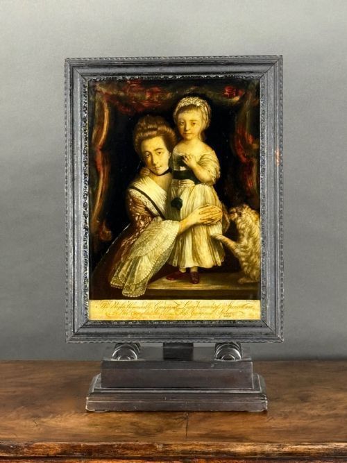 fig 2. A pair of eighteenth-century reverse glass mezzotint prints depicting Georgian lady portraits framed in moulded wooden borders.