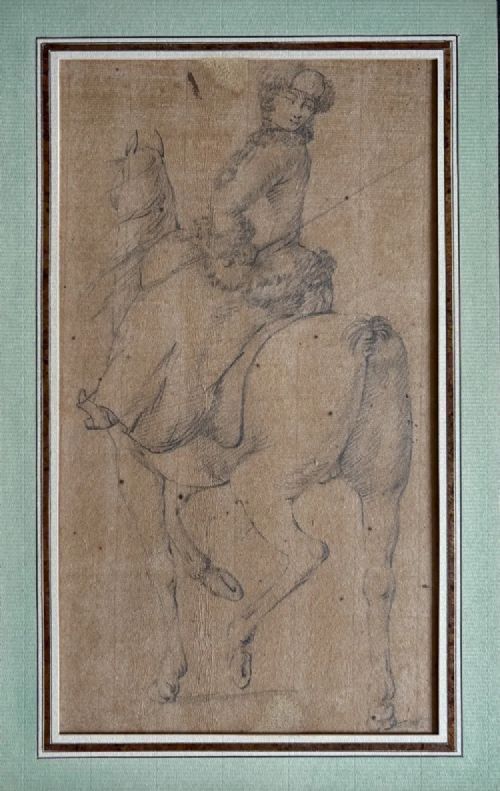 fig 2. An early eighteenth-century framed drawing on paper depicting a rider mounted on a horse, set within a sage green mount and a carved gilded frame.
