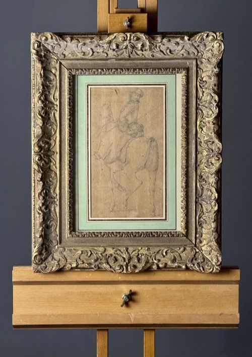 fig 3. An early eighteenth-century framed drawing on paper depicting a rider mounted on a horse, set within a sage green mount and a carved gilded frame.