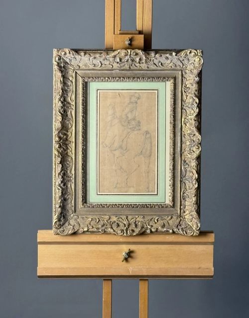 fig 4. An early eighteenth-century framed drawing on paper depicting a rider mounted on a horse, set within a sage green mount and a carved gilded frame.