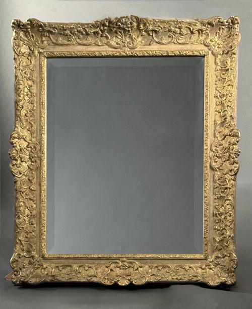FINE ROCOCO REVIVAL GILTWOOD FRAME WITH BEVELLED MIRROR PLATE.