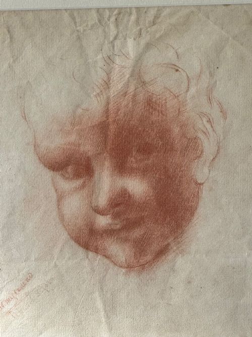 fig 1. A pair of framed antique red chalk drawings on paper depicting a childs head and a draped standing figure, set in ebonised frames with gilt inner rims.